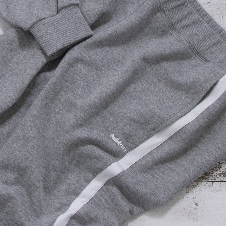 meme rirerire/Mロゴプリント サイドライン スウェットパンツ