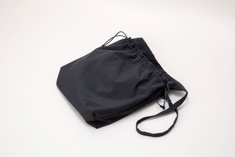 ERA.  TAS BIG RED CROSS APRON BAG BLACK